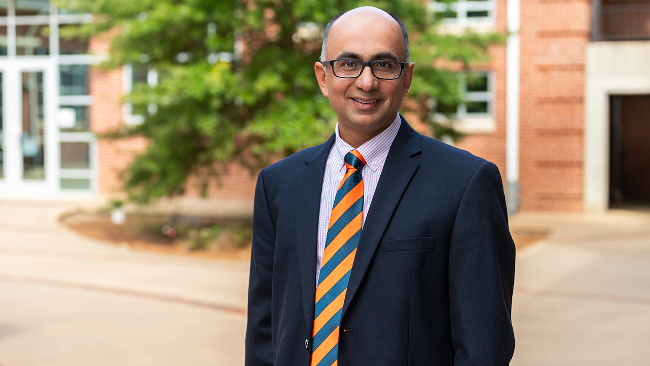 Sushil Adhikari smiles for photo on Auburn campus