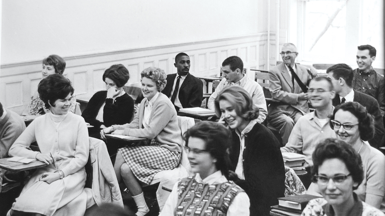 harold franklin sits in a classroom with other students