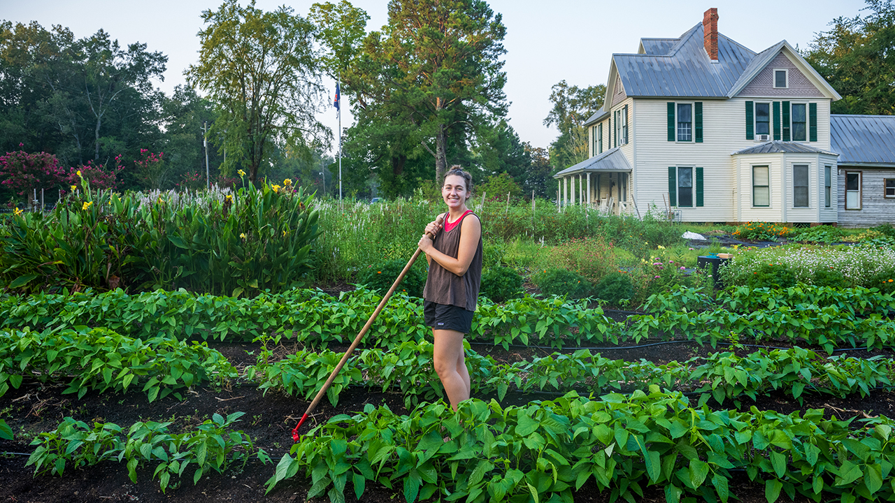 A student hard at work in an APLA garden
