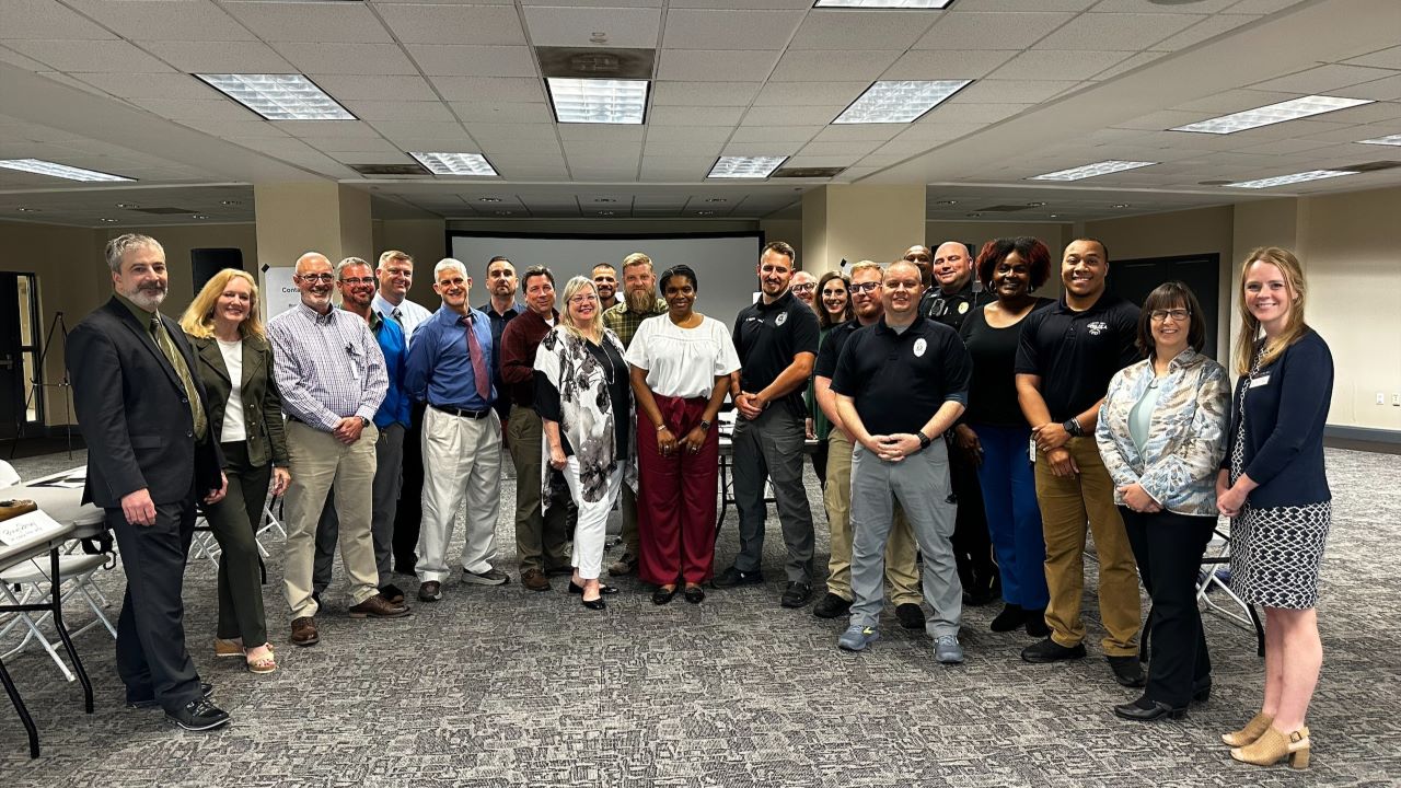 Representatives from East Alabama social services and the Opelika Police Department at the SIM training workshop