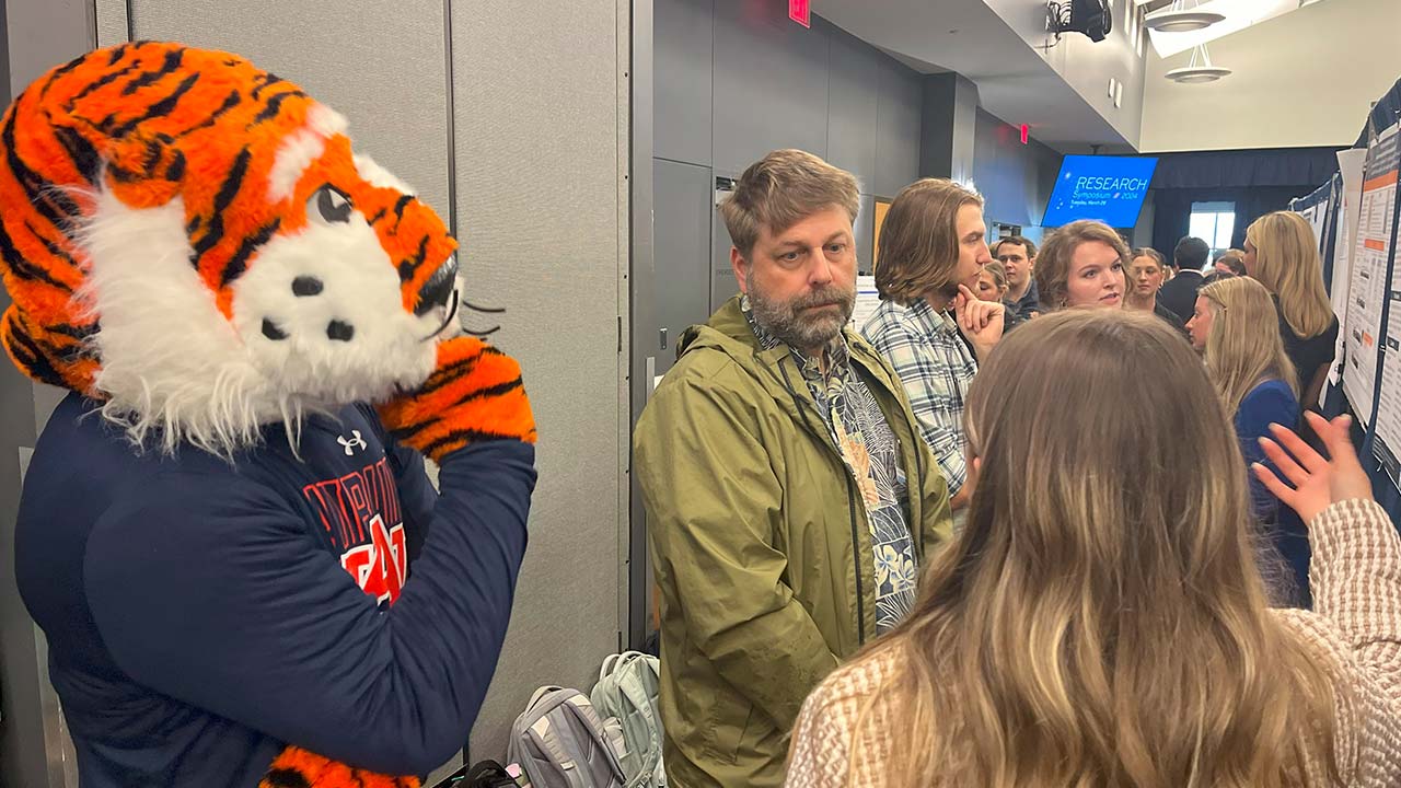 Aubie the Tiger with participants at the 2024 Auburn Research Symposium