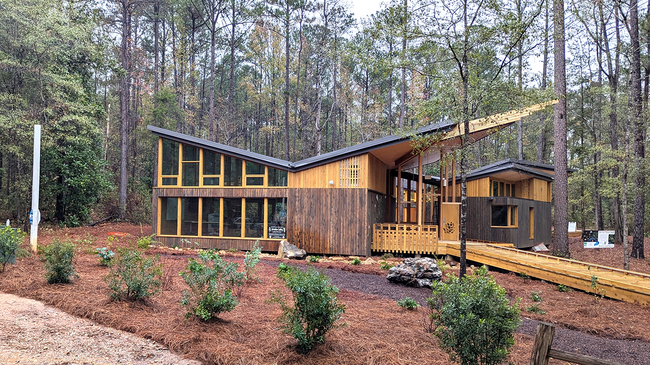 Situated near the North College Street entrance to the Kreher Preserve and Nature Center, the Environmental Education Building is designed to be a dynamic focal point of the KPNC, which welcomes tens of thousands of visitors and program participants annually.