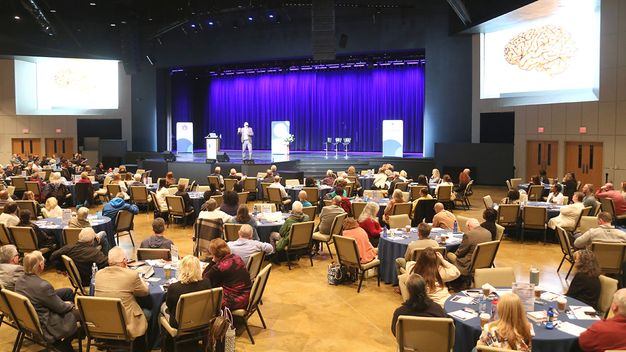 Attendees listen to a speaker at the 2024 COACH Summit