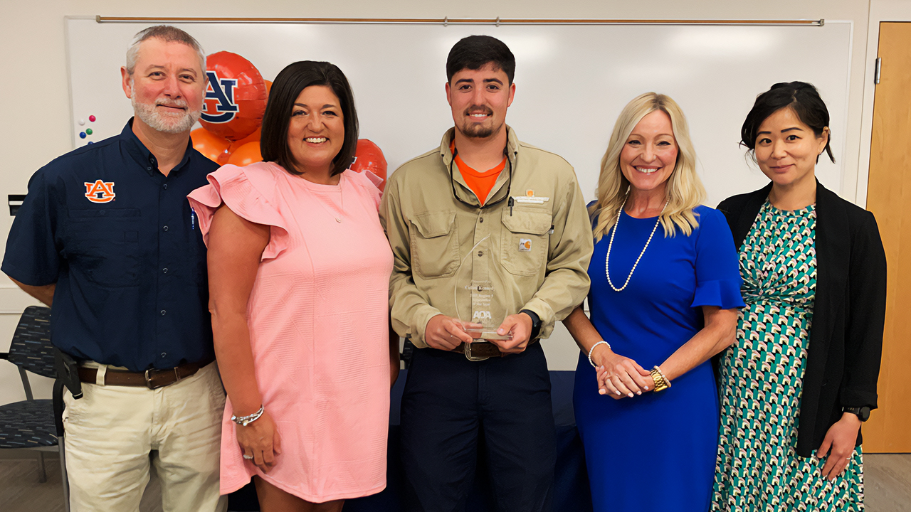 Facilities Management's Cullen Kennedy, electrician, receives the Alabama Office of Apprenticeship's Central Alabama Apprentice of the Year Award.
