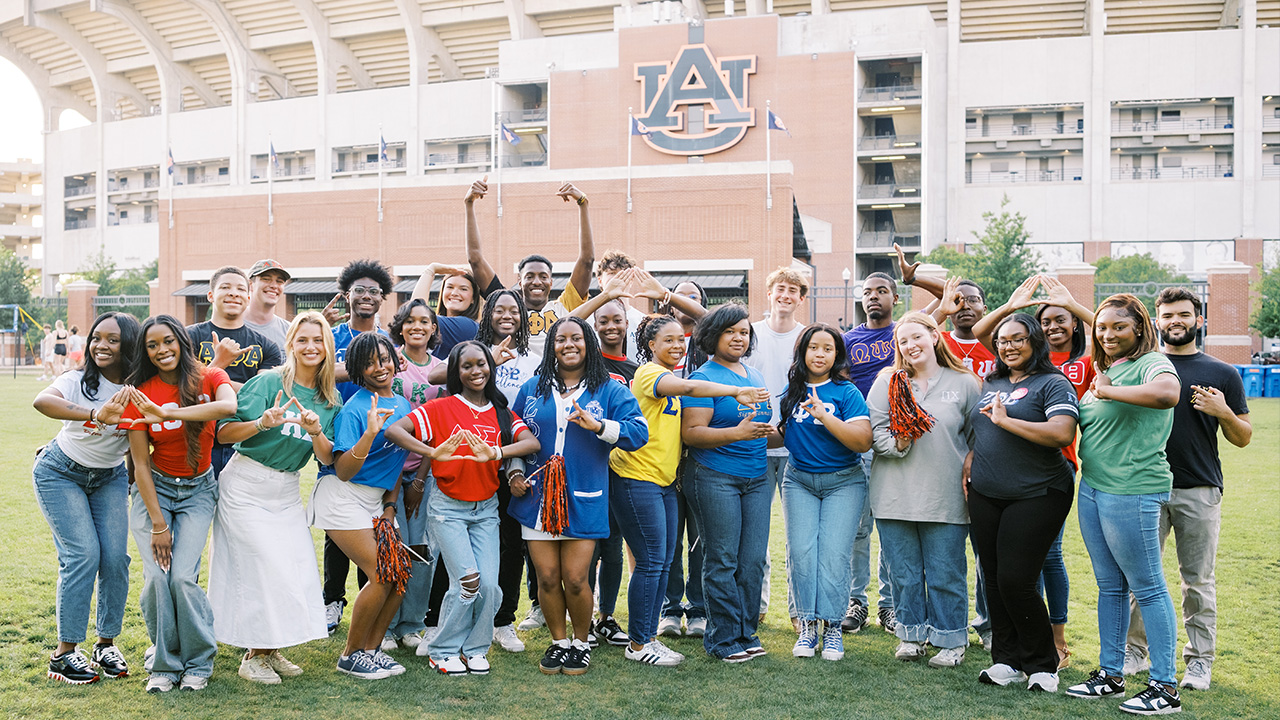 Auburn Greek LIfe students posing on Campus Green