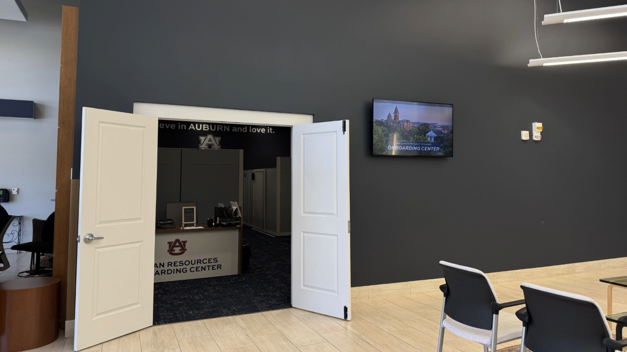 Auburn onboarding center entrance with logo and welcome screen.
