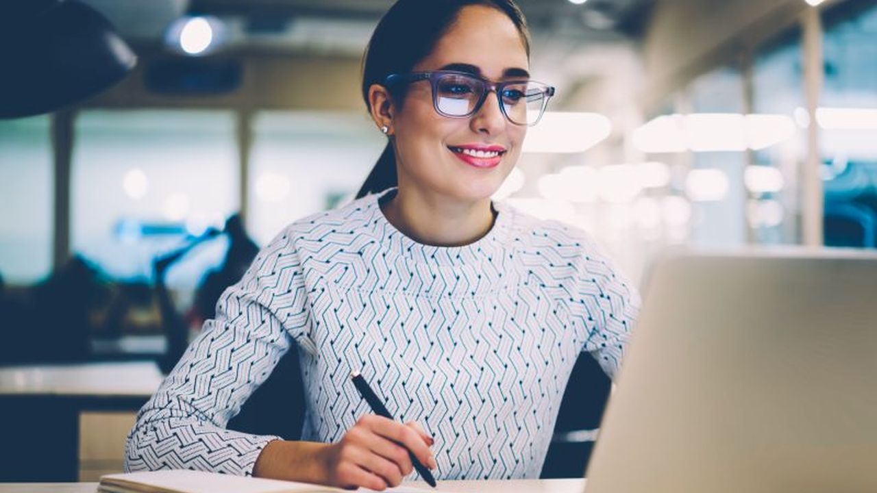 Woman staring at a laptop screen 