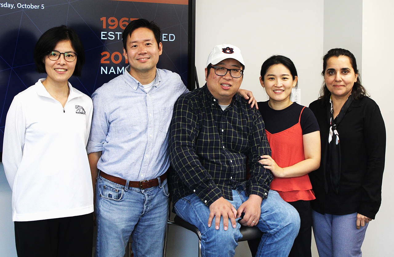 Prof Kankang Qi, wife Chen Yan and department colleagues