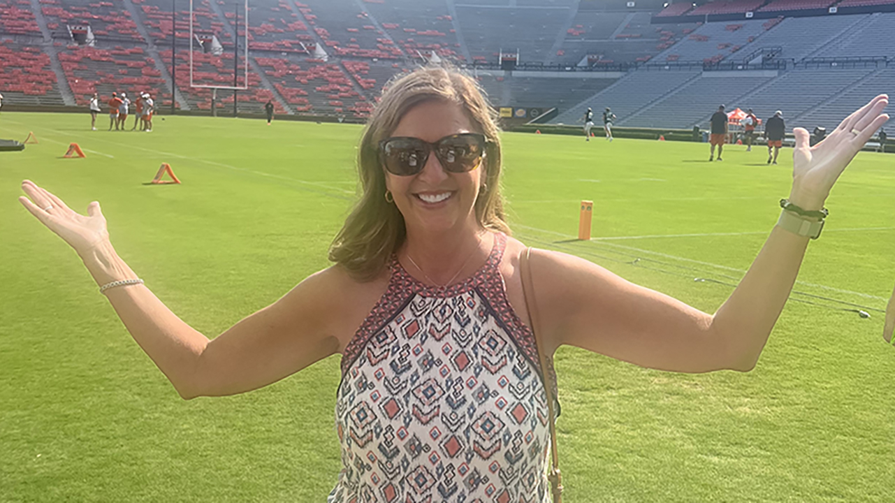 Woman standing on football field