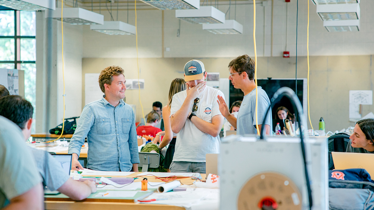 Assistant Professor David Shanks instructing a group of students in his studio class