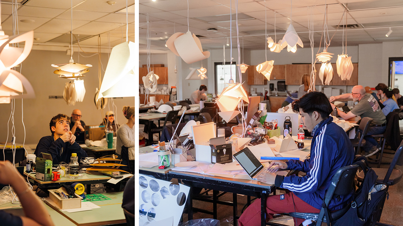 Students in an industrial design studio with self-made lighting hanging throughout