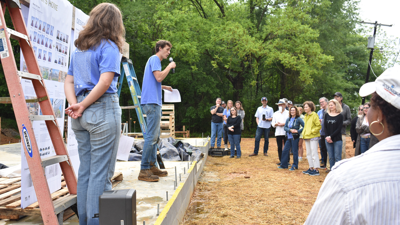 3rd-year students presenting their project to Pig Roast attendees
