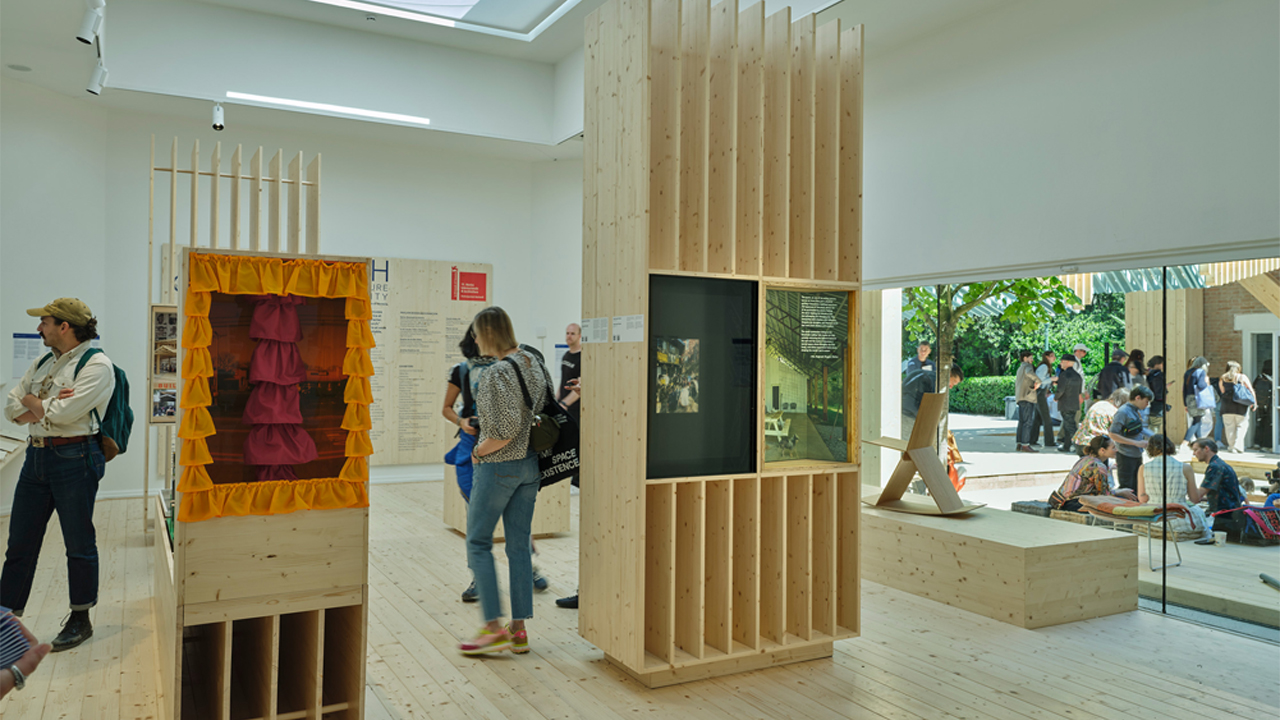 Visitors view interior exhibit of US Pavilion in Venice