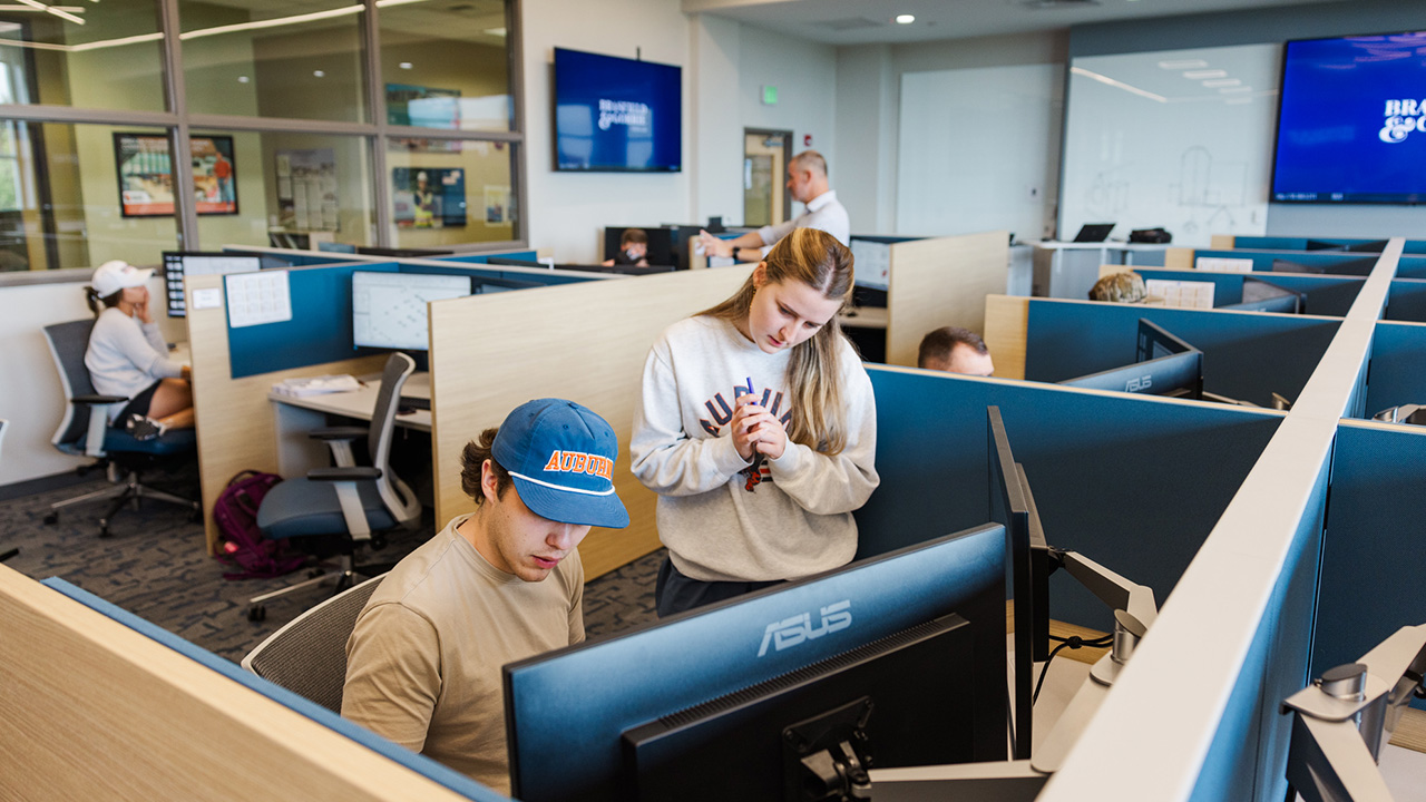 Photo of student working together at a computer