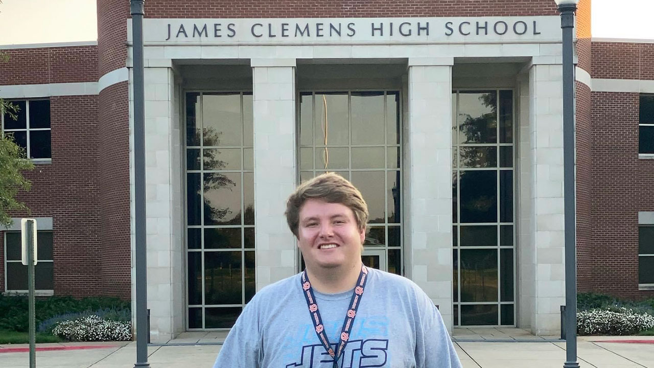 Andrew McKibbin in front of James Clemens High School