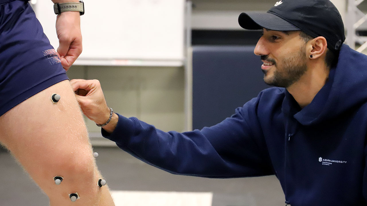 A Kinesiology student works in a lab.