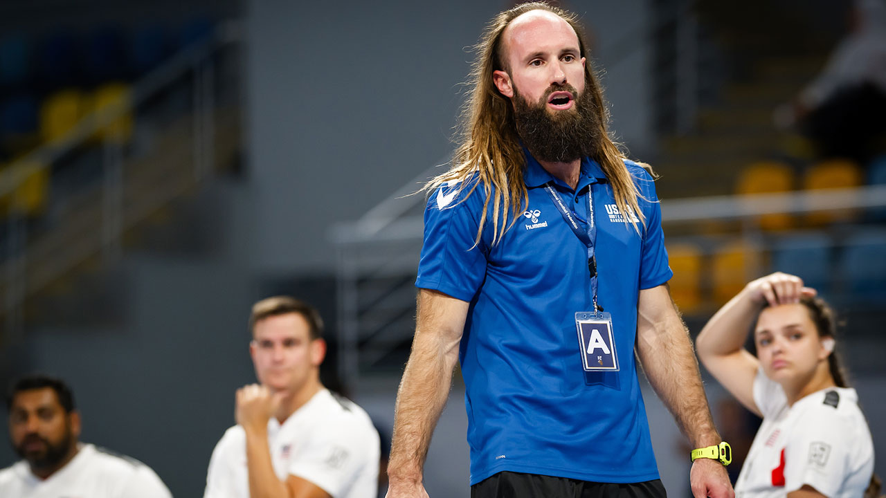 Ford Dyke is pictured inside a gym coaching a team.