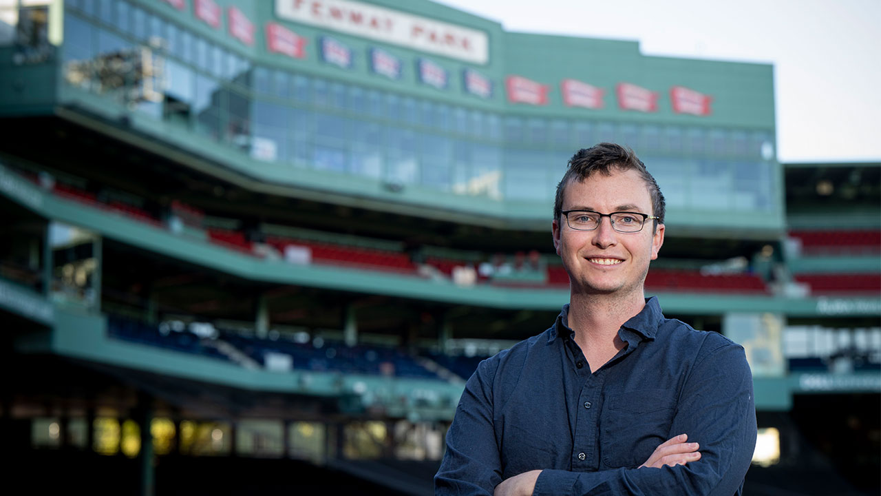Kyle Wasserberger is pictured crossing his arms and posing for a photo inside Boston