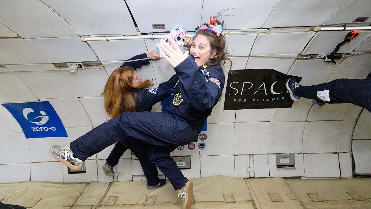 Megan Tucker is pictured floating while on a Zero G flight recently.