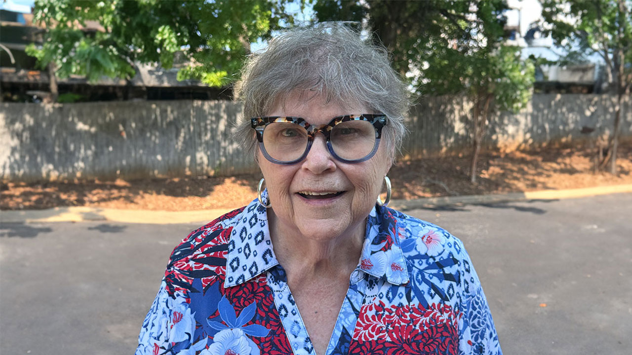 Addie Adams is pictured smiling outdoors.