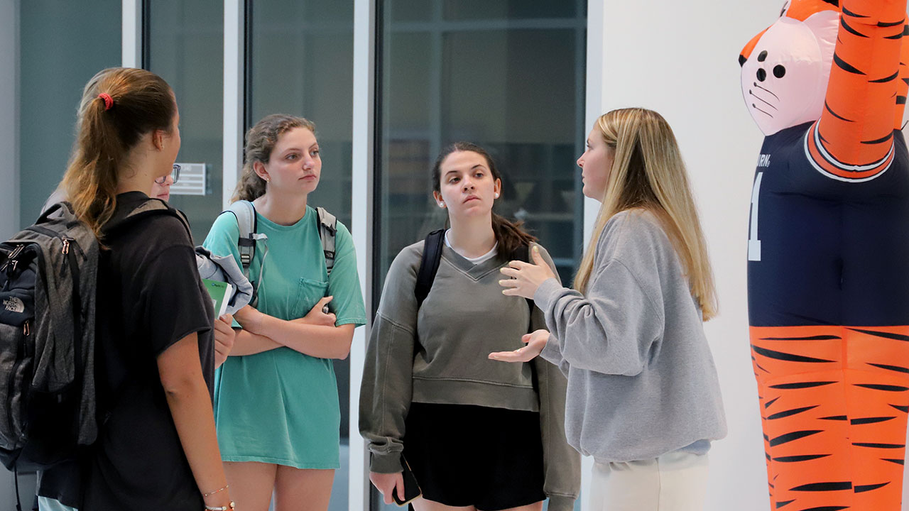A student ambassador leads a tour