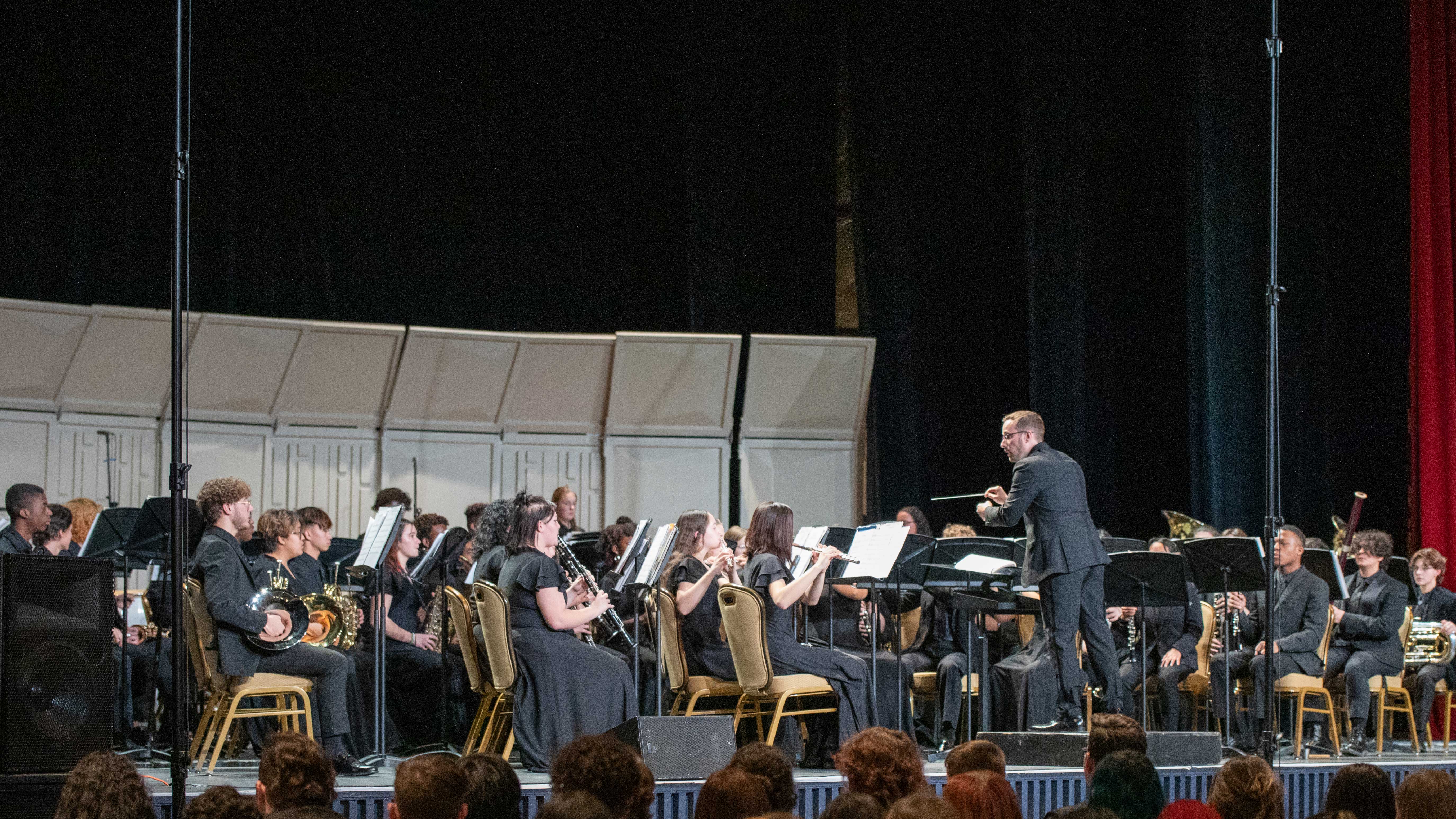 Joshua Race directing the band