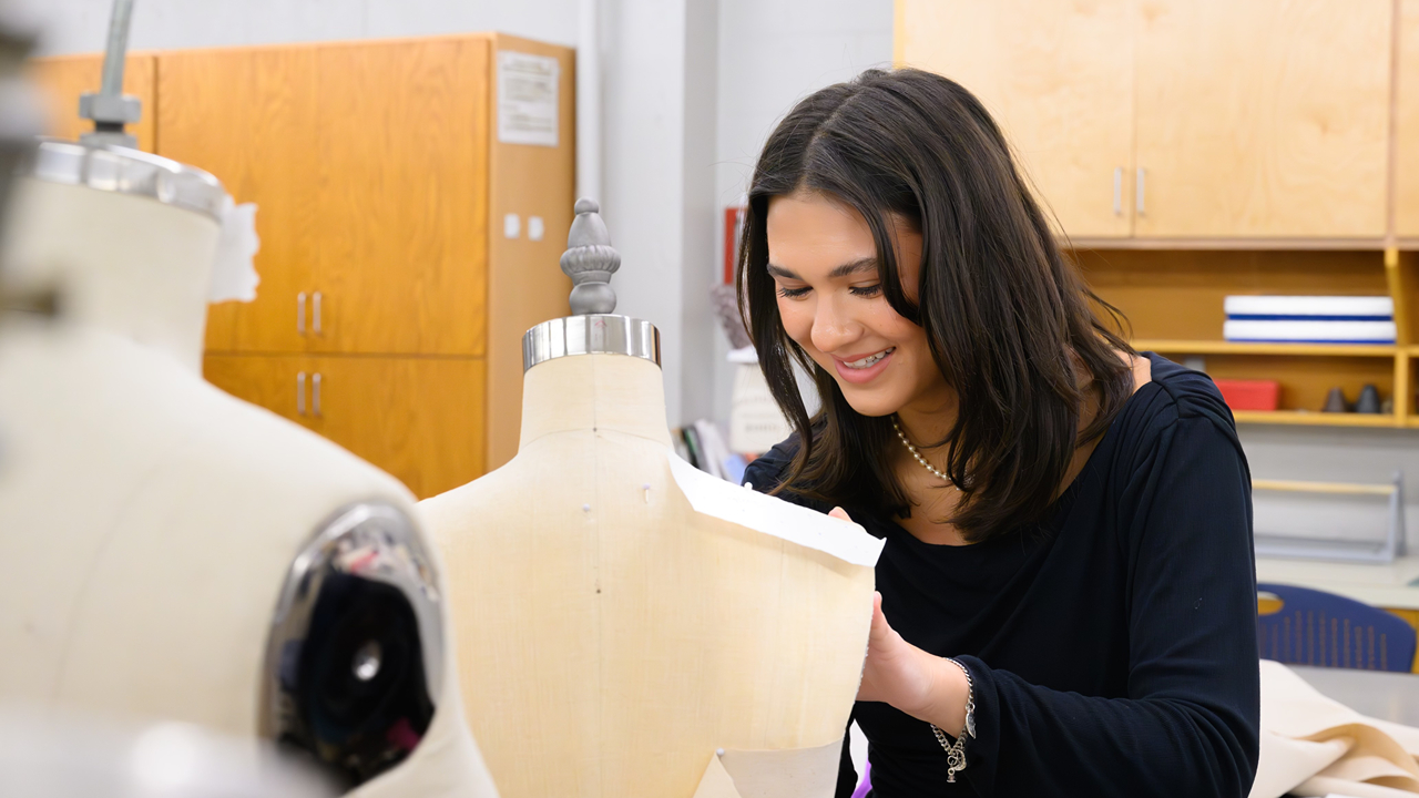 Sydnee Johnson works on garment