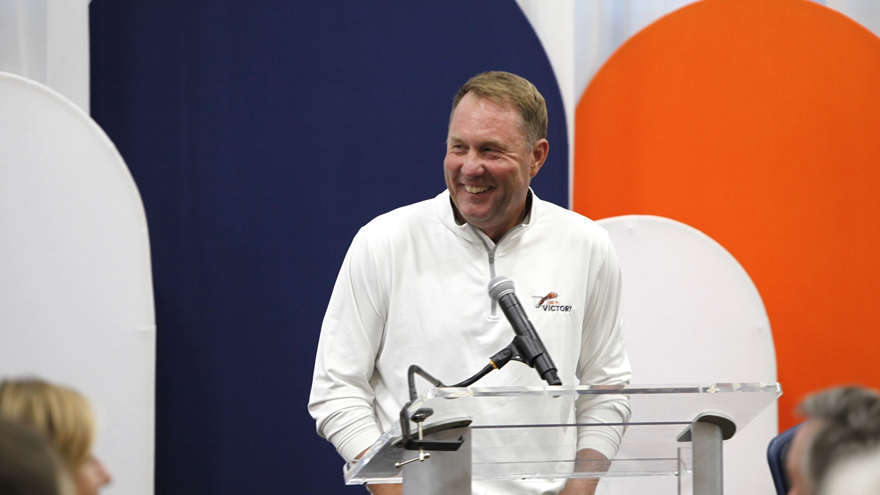 Hugh Freeze speaking at podium