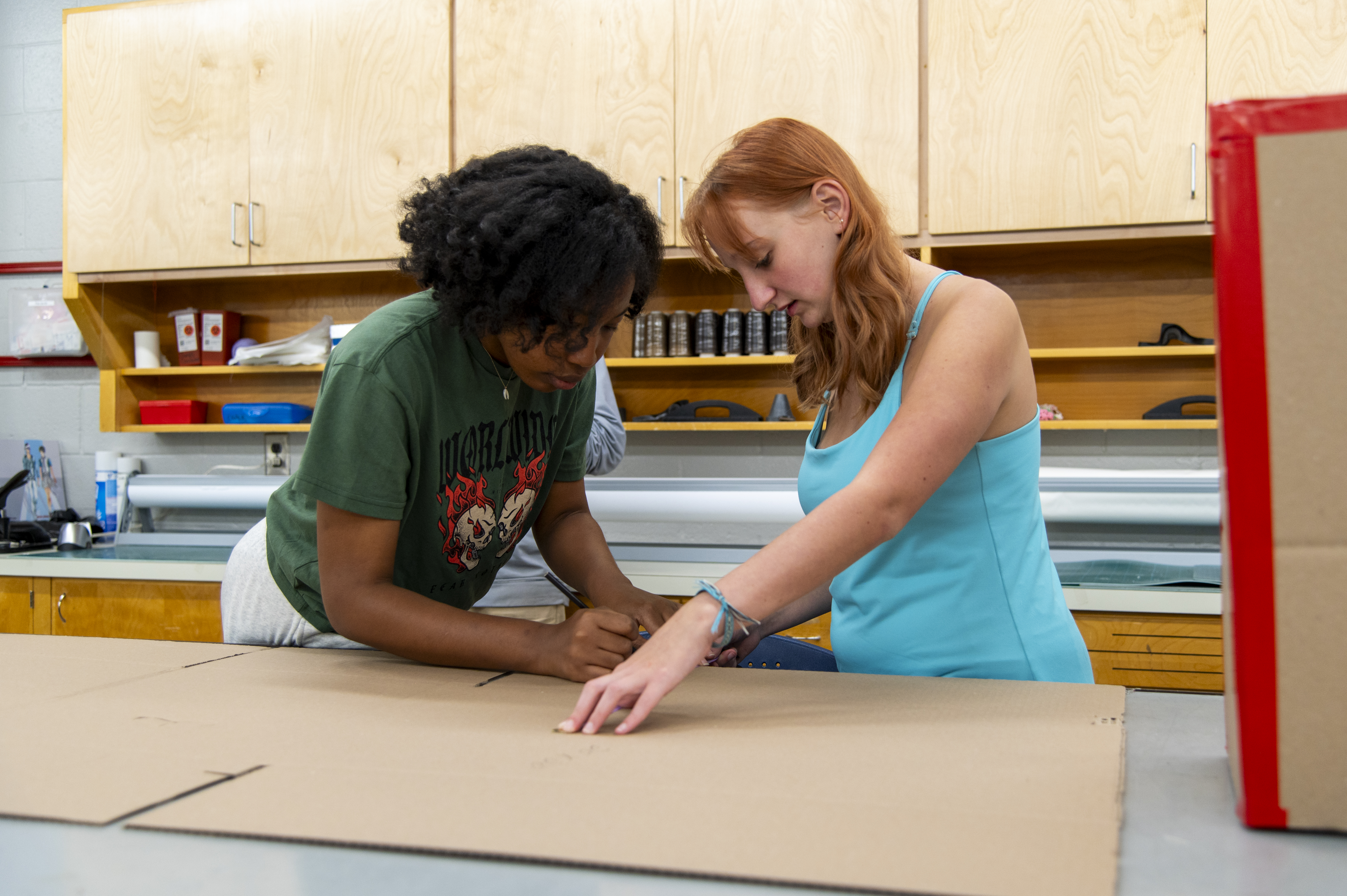 Students prepare to build a costume