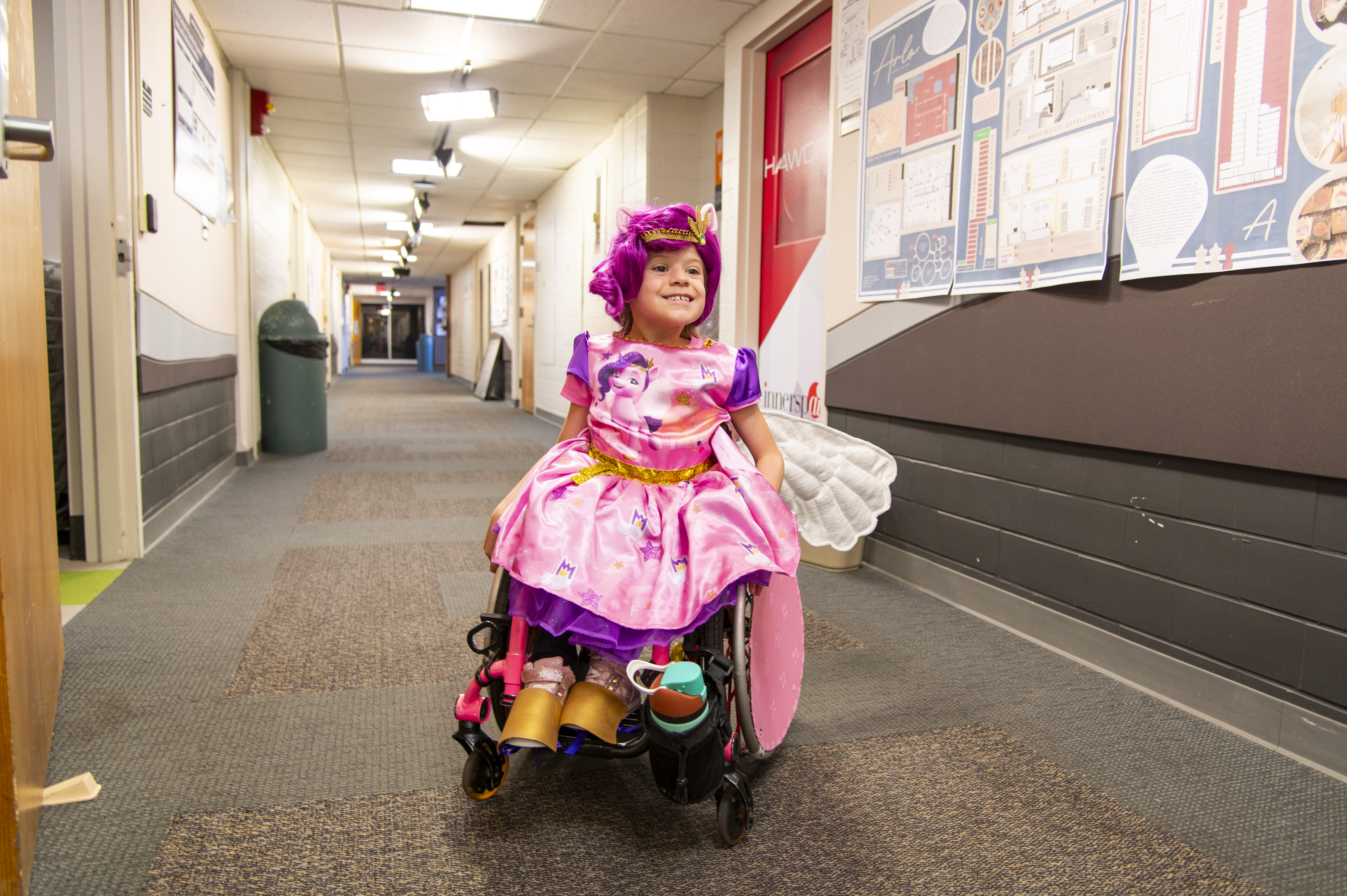 Logan McCool smiles with her completed Halloween costume