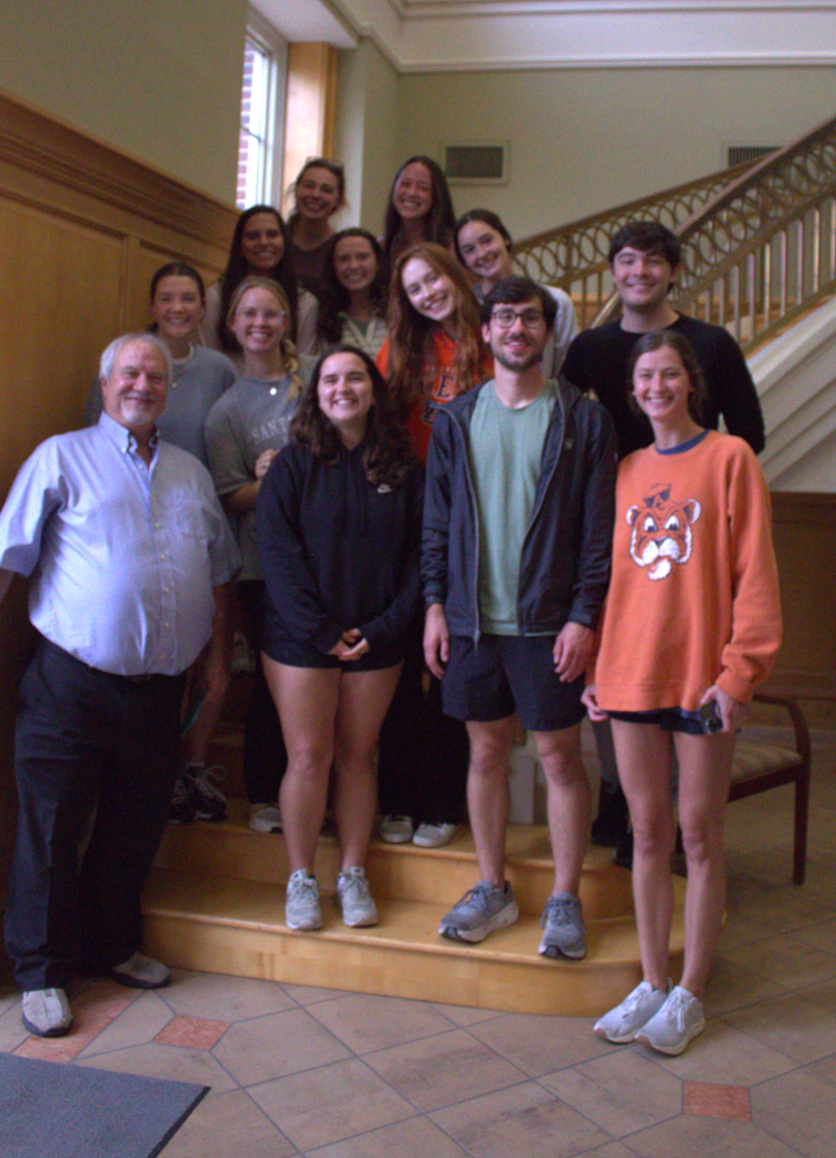 Dr. Doug White is pictured with some of his students at his retirement party.