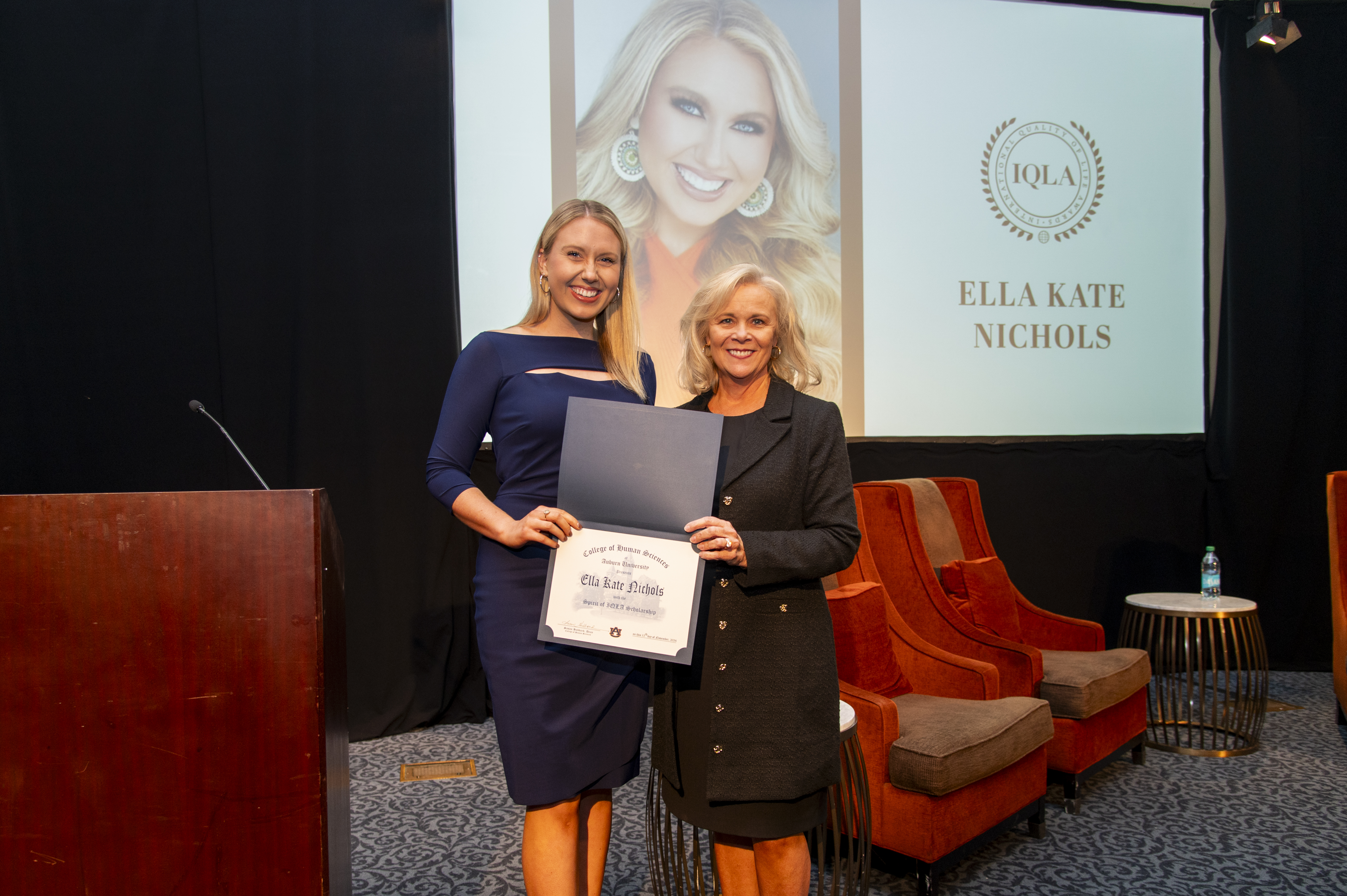 College of Human Sciences Dean Susan Hubbard, right, presents Ella Kate Nichols, a senior studying HDFS, with the Spirit of IQLA Scholarship.