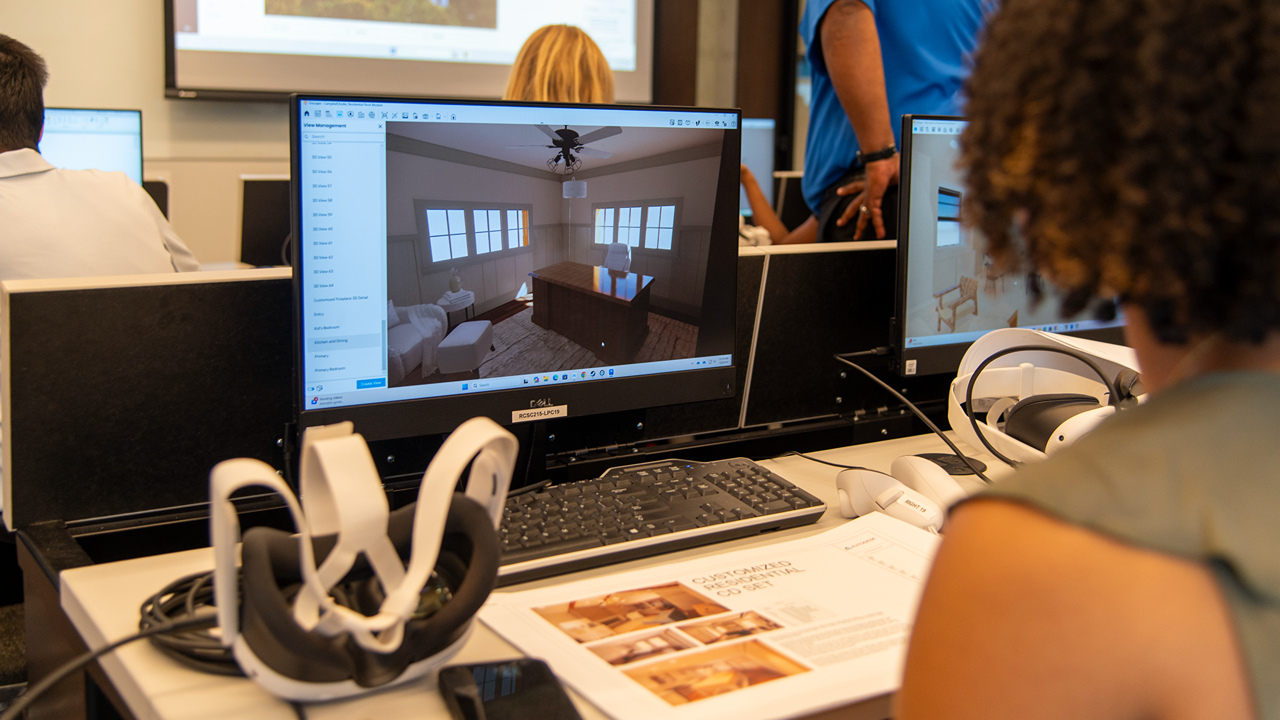 Interior design students work on a virtual reality project.