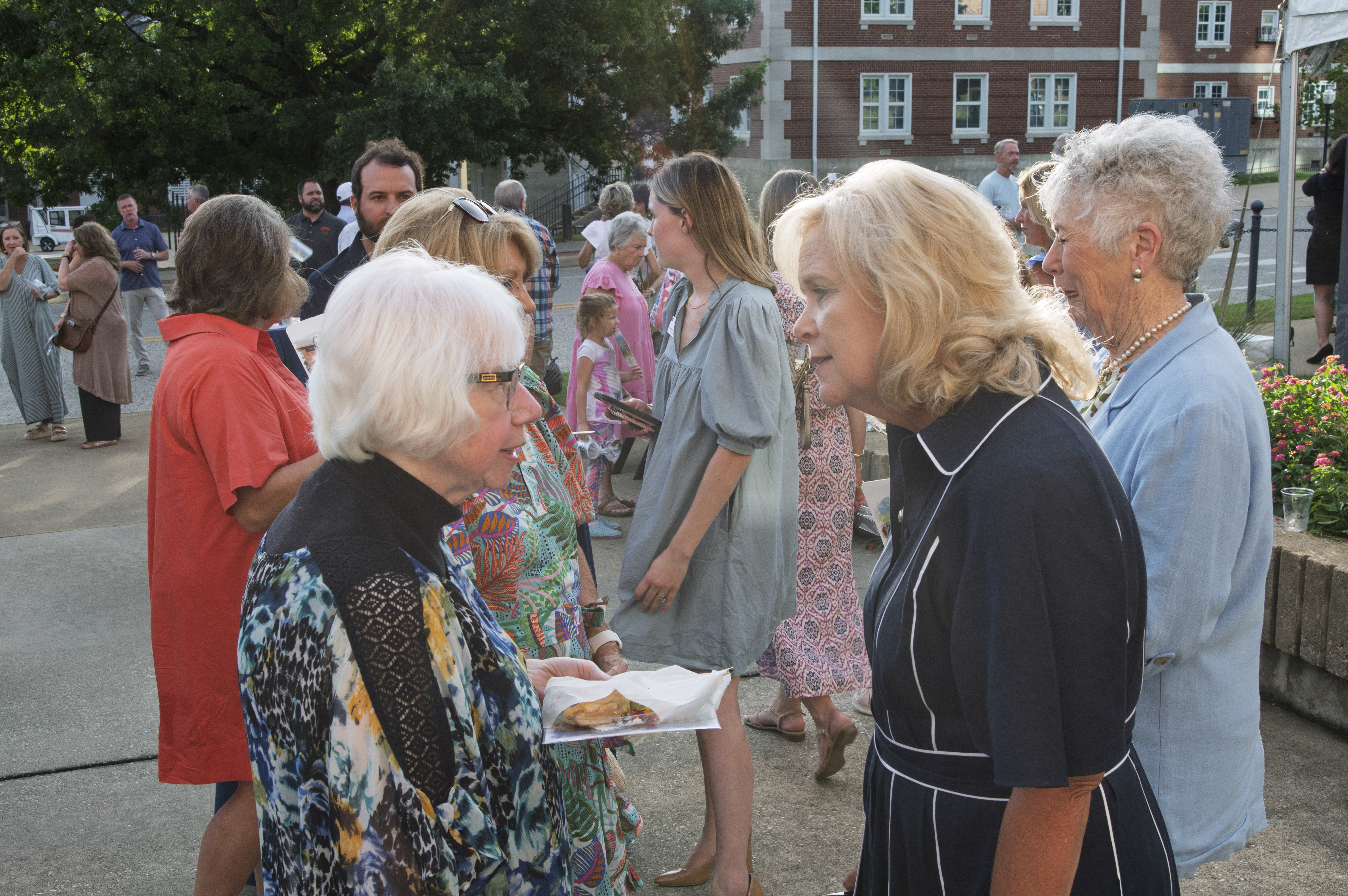 Susan Hubbard, right, speaks with a guest at the Farewell to Spidle event