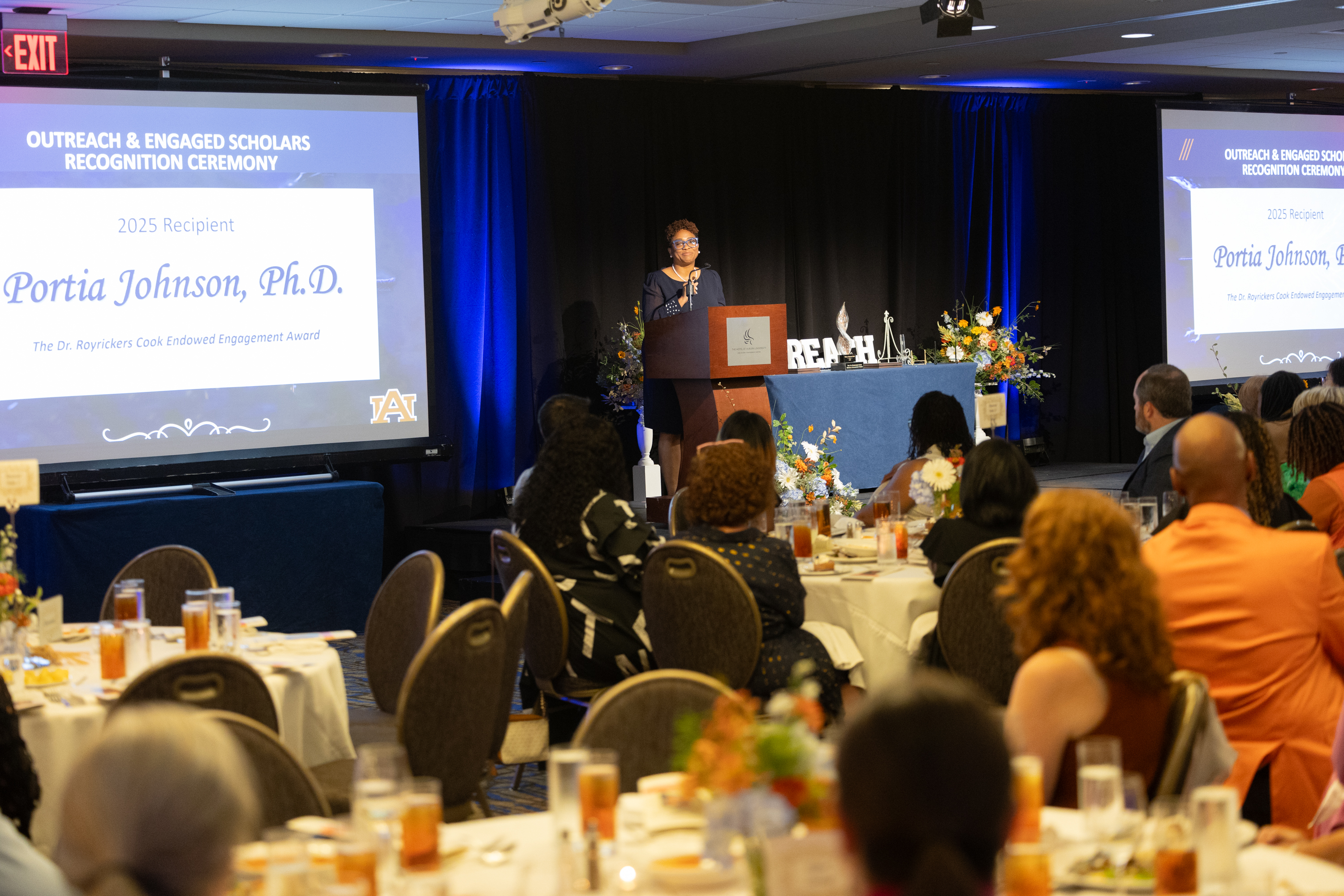 Portia Johnson speaks after accepting her award