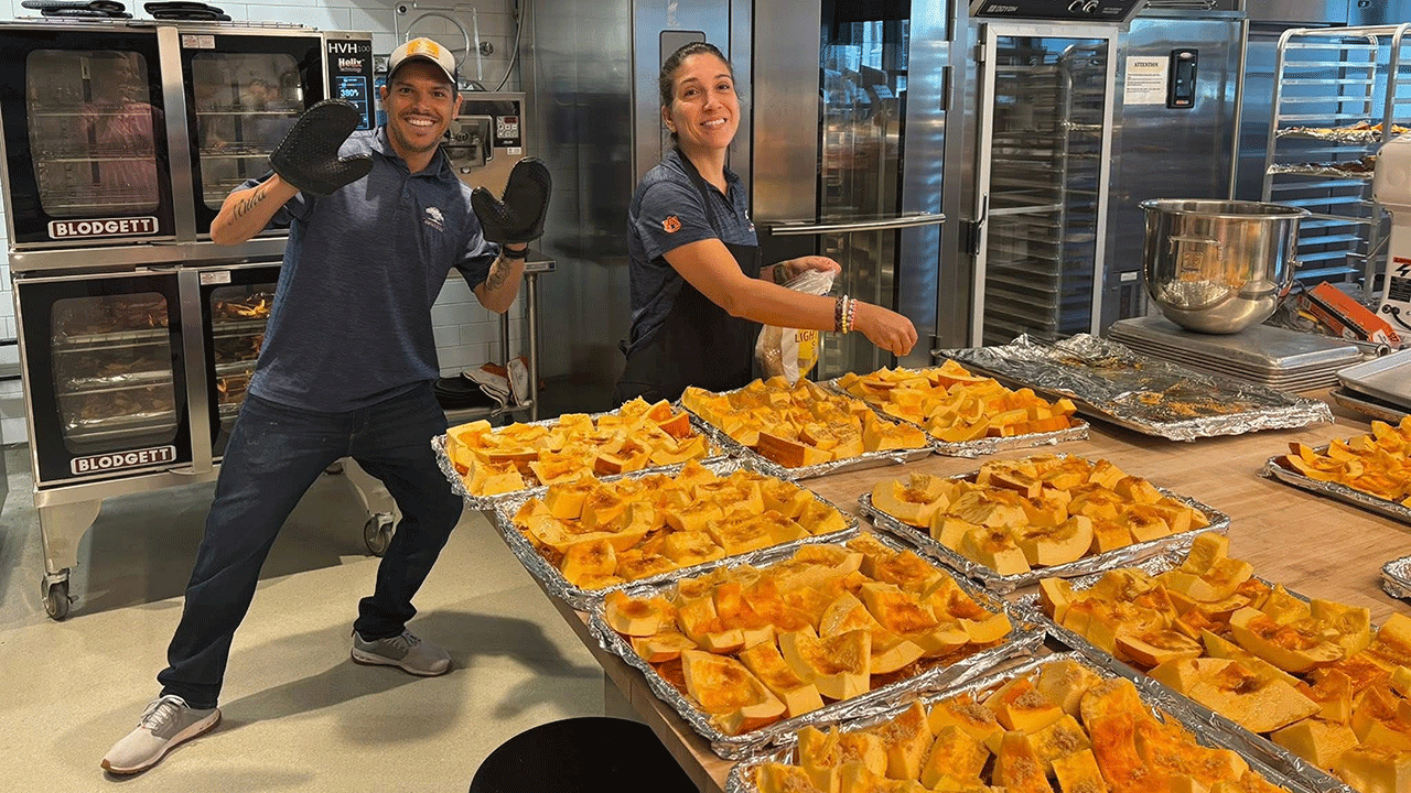 Members from the Department of Horticulture and Horst Schulze School of Hospitality Management show off the finished pumpkin beer