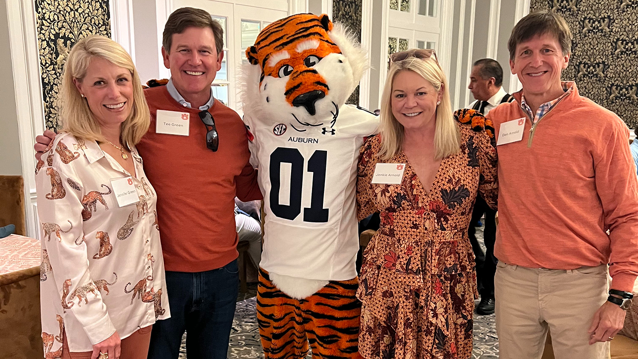 Dan Arnold, right, attends an Auburn University event