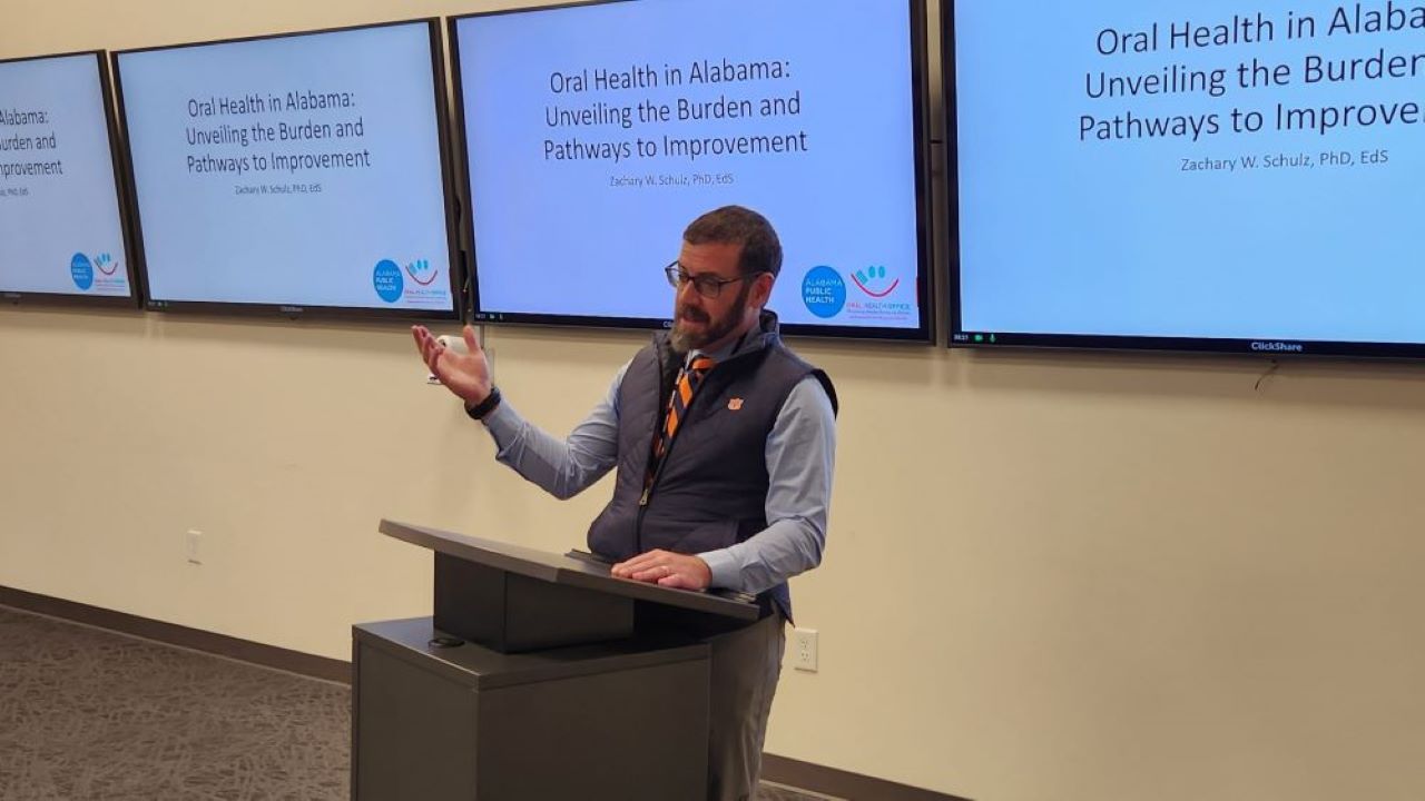 Zachary Schulz presenting report