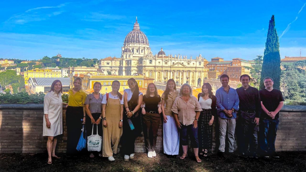 The Rome Summer Archival Seminar group posing for a photo in front of the Vatican