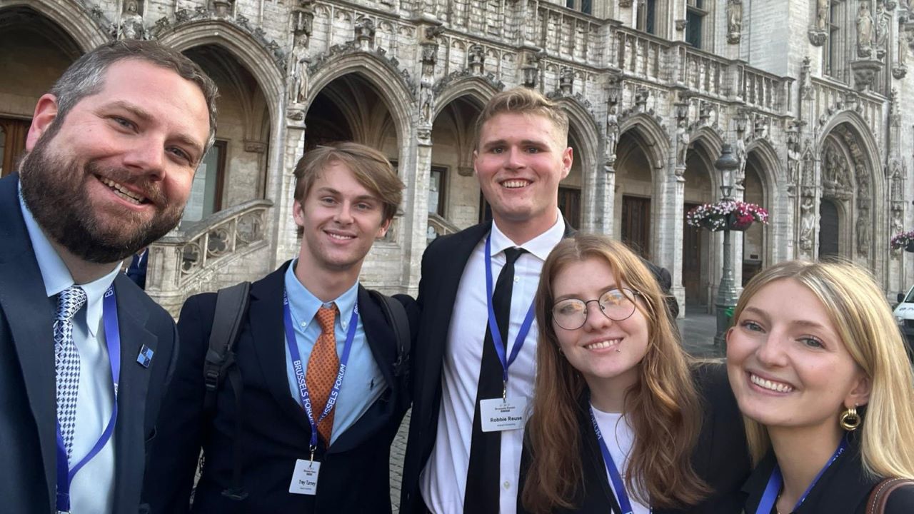 Matt Clary and students standing outside the GMF Brussels Forum