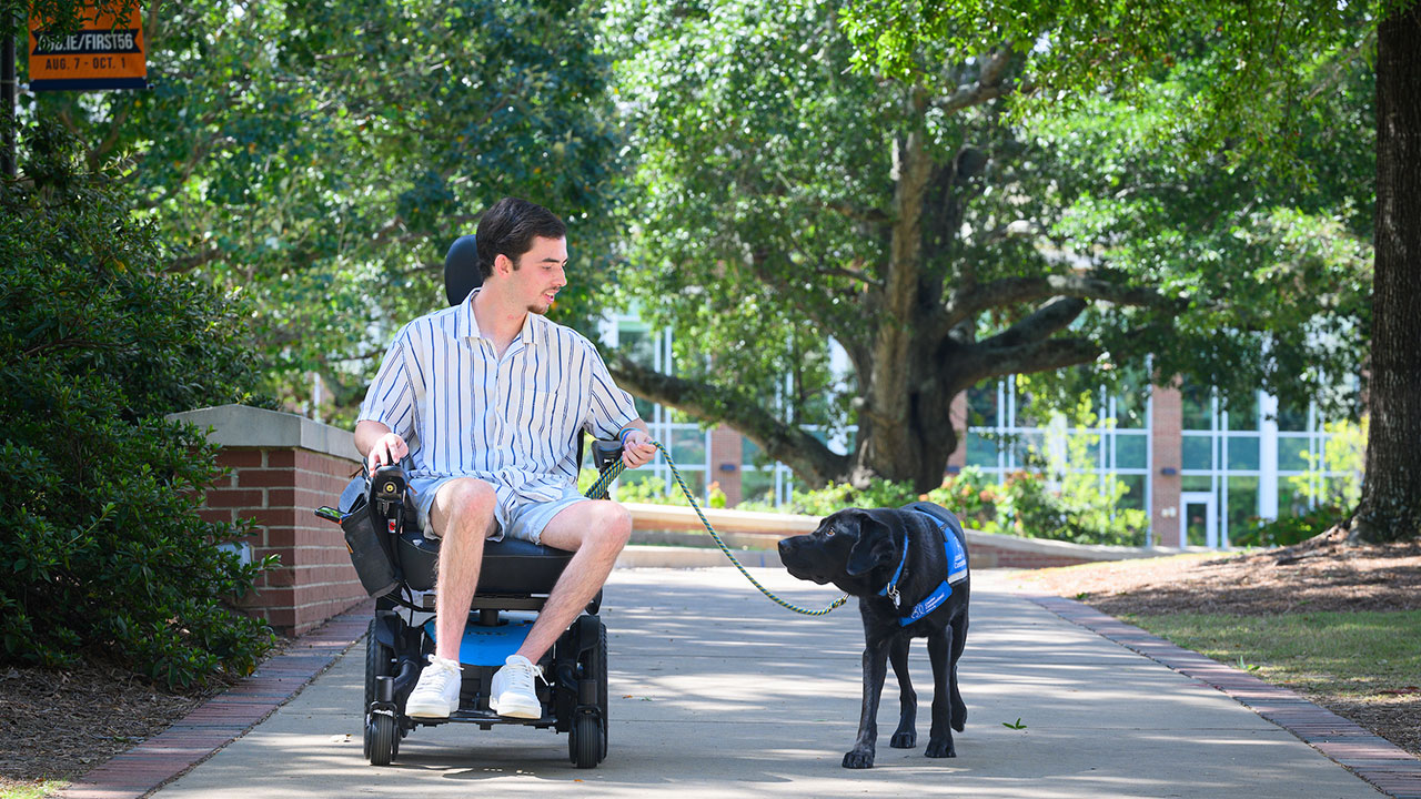 Noah Griffith and his service dog, Schooner