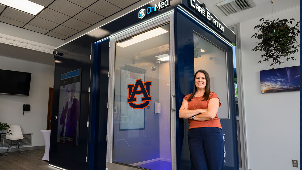 Rachel Snoddy, Alabama Extension coordinator for Chambers County, stands in front of the OnMed Care Station