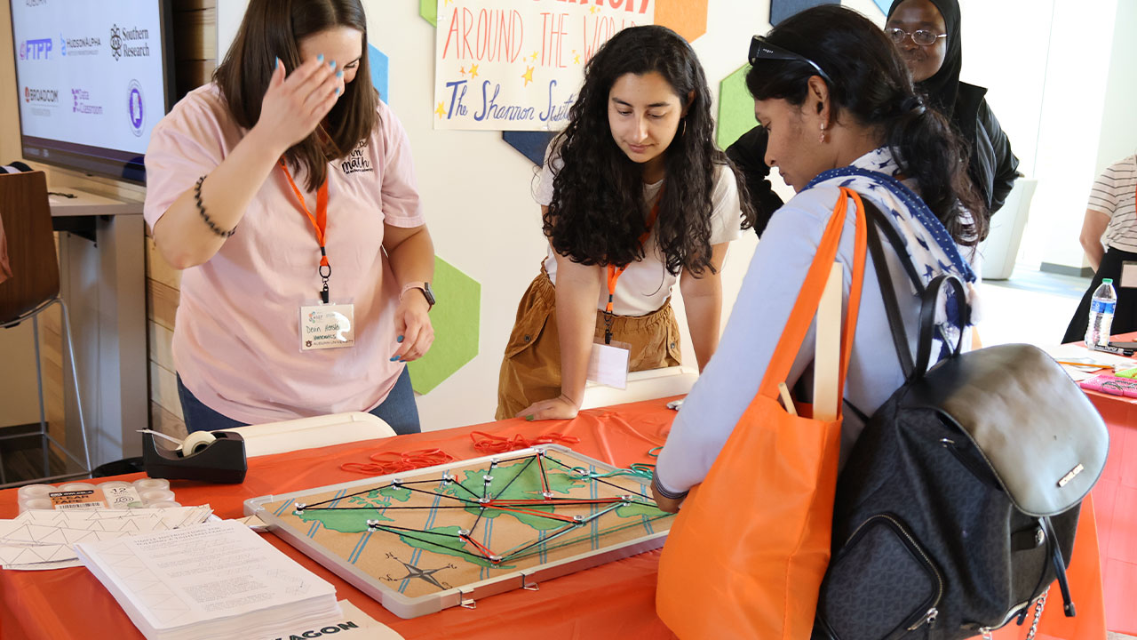A young ASEF participant visits an interactive exhibit