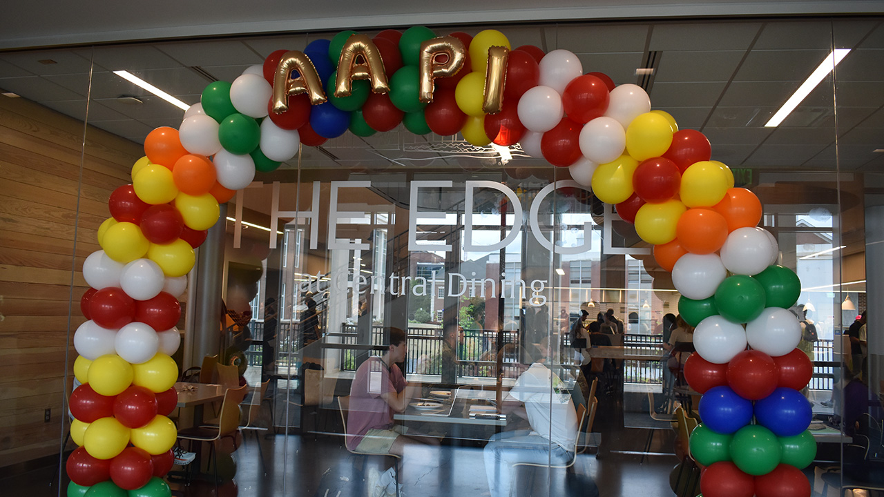 a balloon arch around the glass walls of the Edge