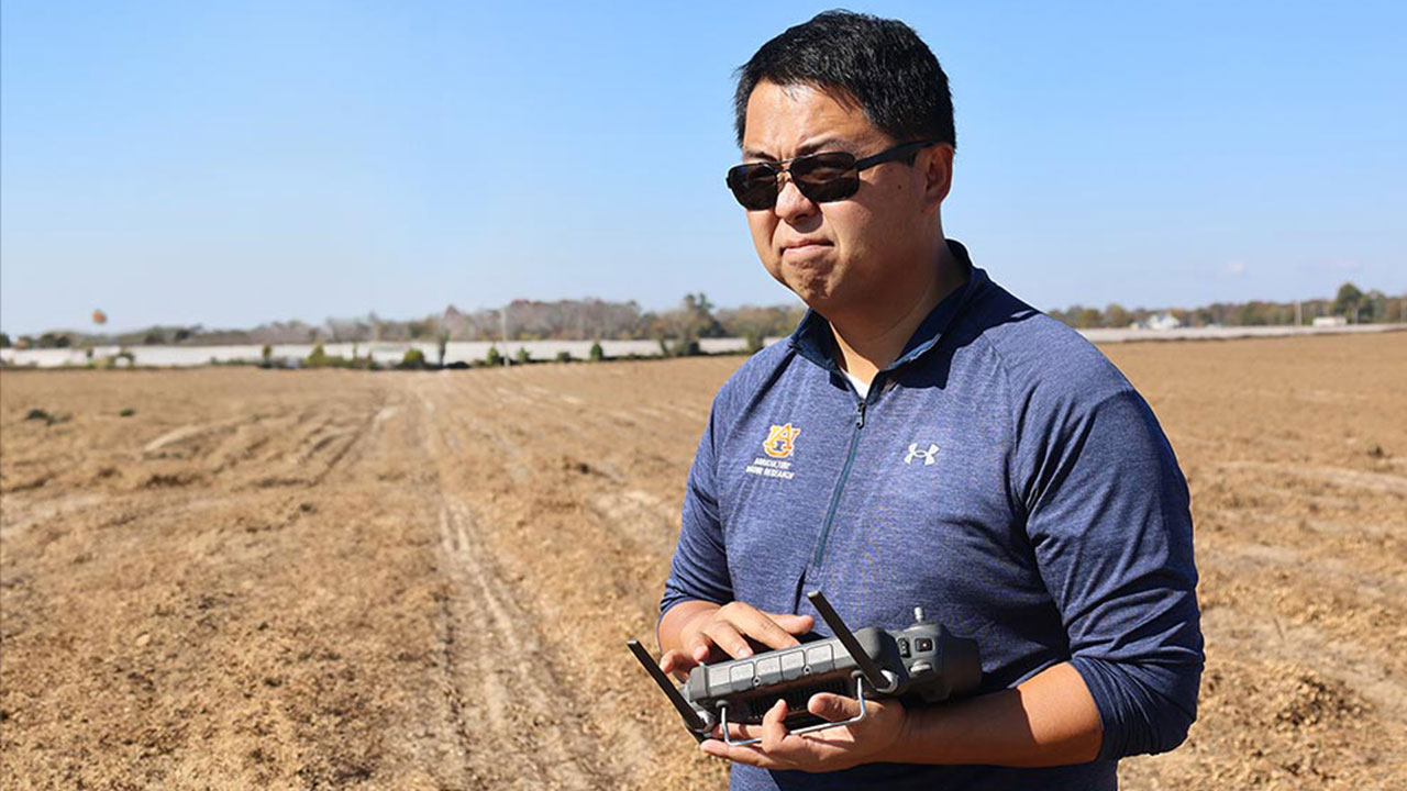 Steve Li is pictured outside using a drone device.