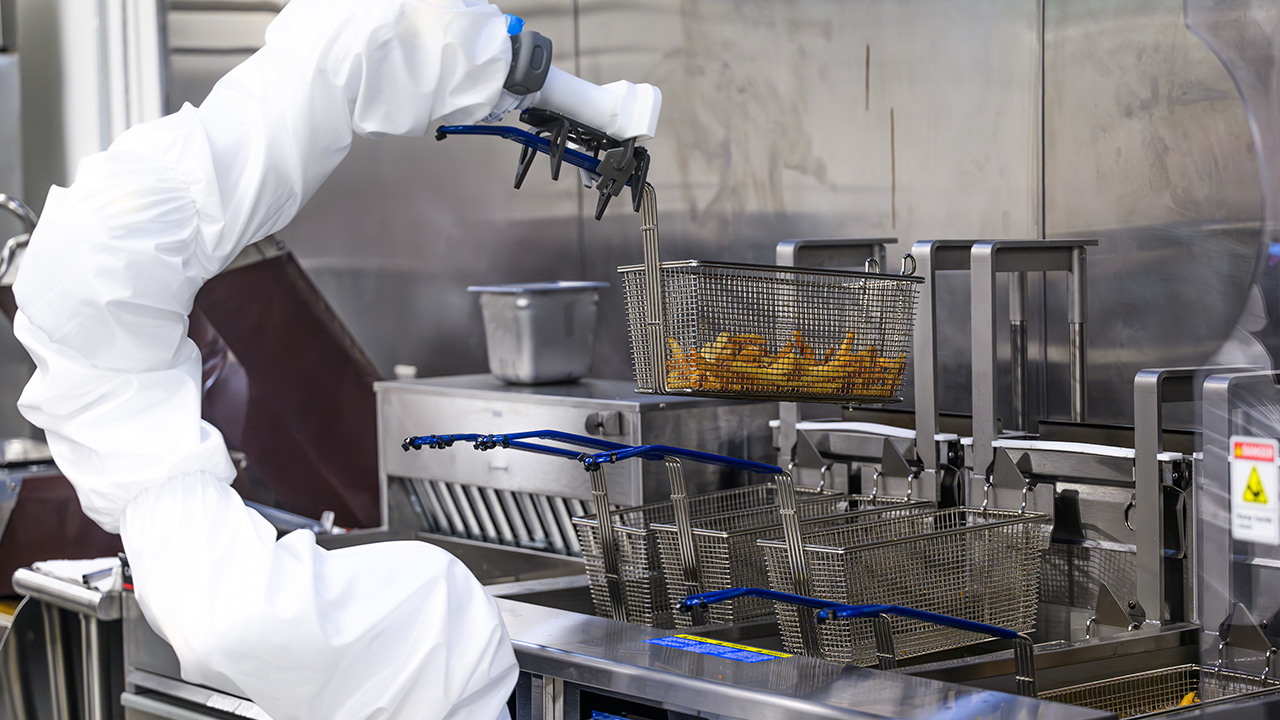 A robotic arm cooks french fries