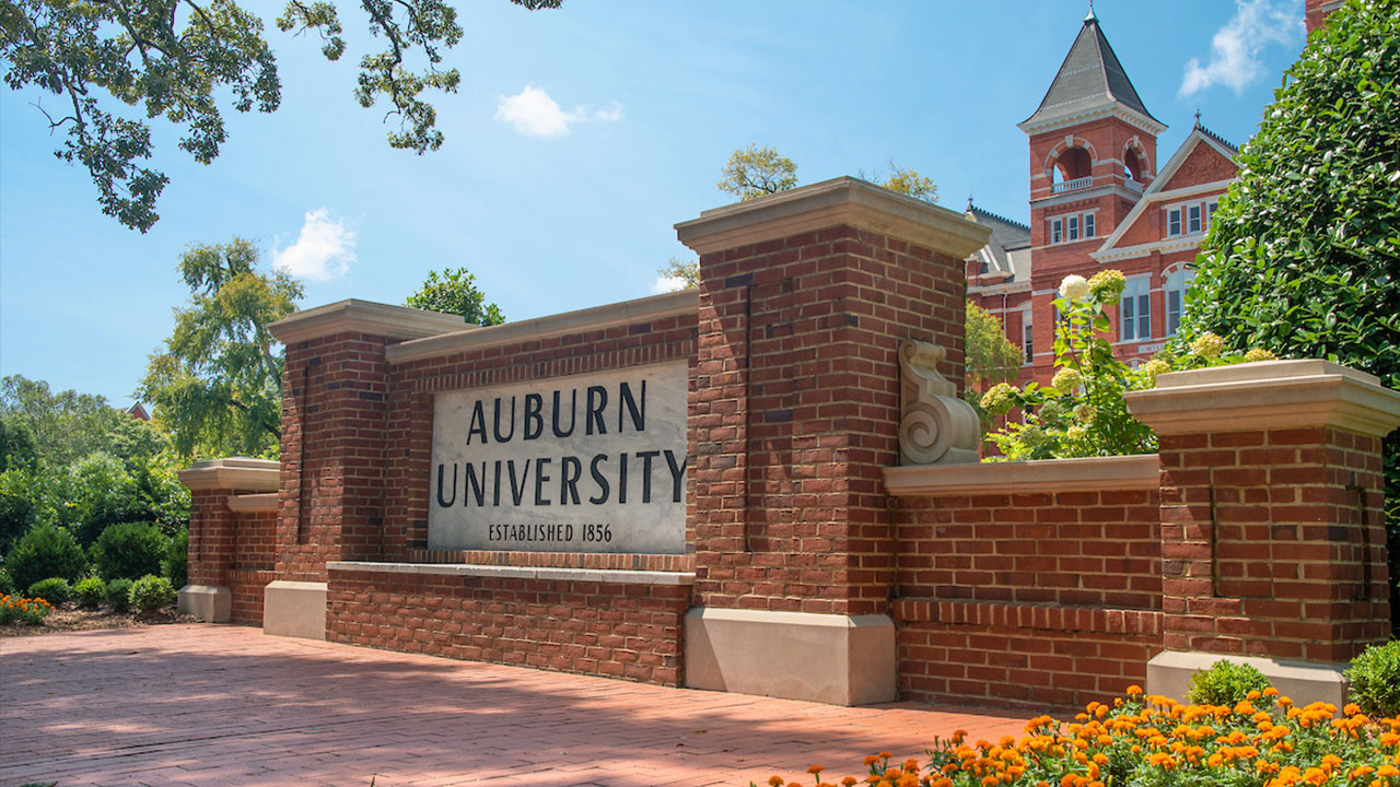 Auburn University sign with Samford Hall in background