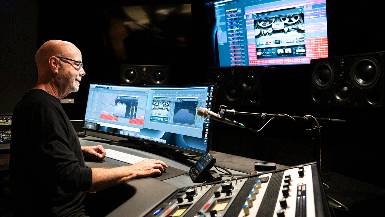 A photo of a music studio showing pianos and a logo that reads Lucky Man Studio