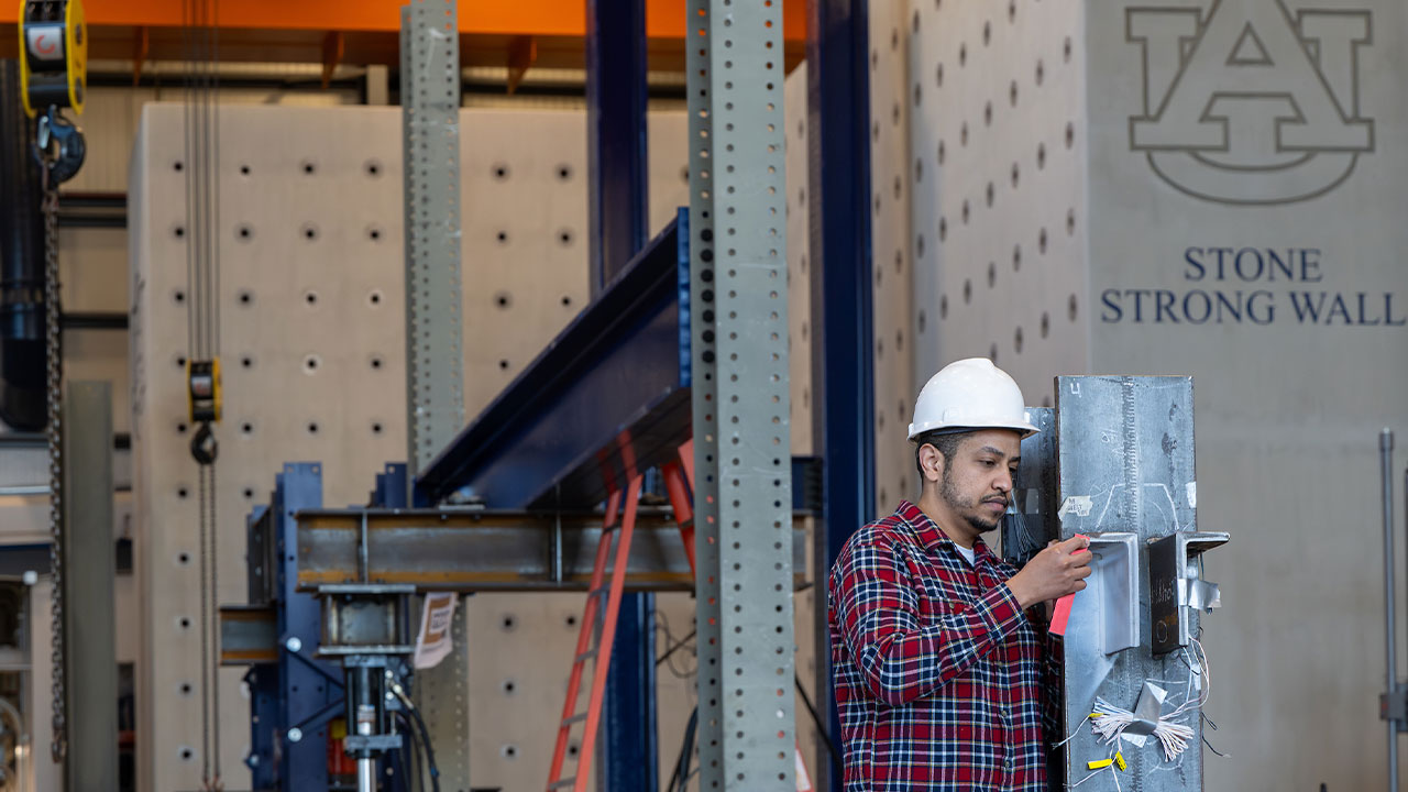 a man works at the Advanced Structural Engineering Lab