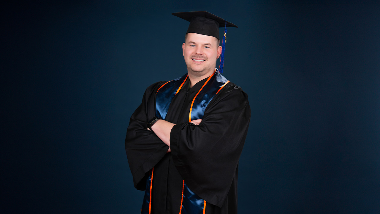 Taylor in graduation cap and gown